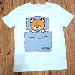 Moschino White Tee with Blue Blanket and Brown Bear Graphic